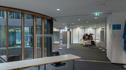 Between flags and new building cafeteria at ESO Headquarters — Stillmotion