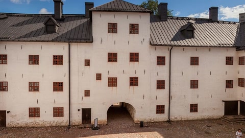 Historic courtyard with white stone buildings — Stillmotion