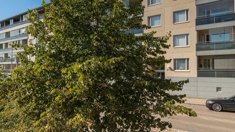 Riverfront promenade by apartment buildings — Stillmotion