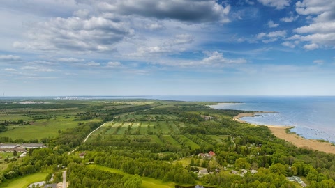 Aerial view of coastal countryside — Stillmotion