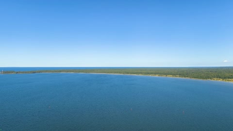 Coastal lagoon with harbor and shoreline — Stillmotion