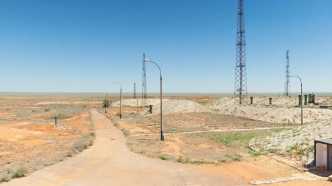 Desert utility site with towers — Stillmotion