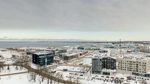 Snow-covered cityscape with church spires — Stillmotion