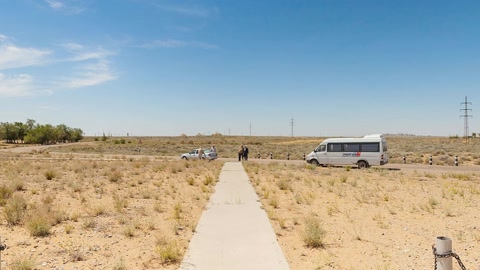 Sandy desert with fenced walkway — Stillmotion