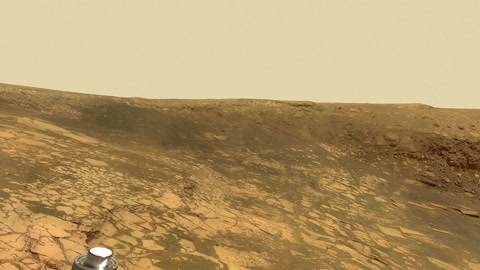 Rocky desert terrain under hazy sky — Stillmotion