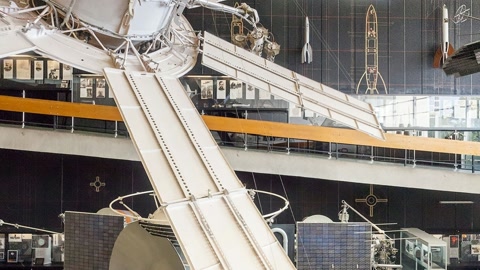 Space museum interior with spacecraft exhibits — Stillmotion