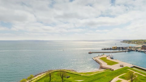 Aerial harbor view over coastal fortifications — Stillmotion