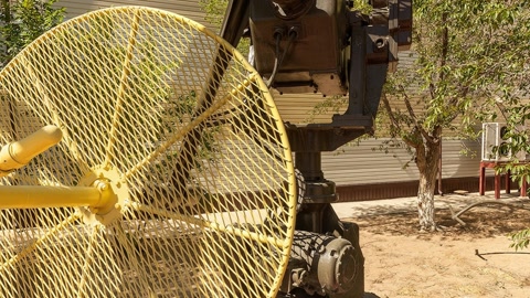 Yellow industrial sculpture installation outdoors — Stillmotion