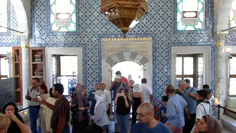 Ornate mosque interior with visitors — Stillmotion