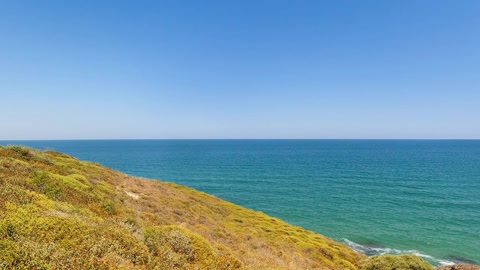 Sandy lagoon with rocky shoreline — Stillmotion