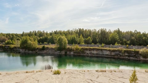 Eroded badlands beside river — Stillmotion