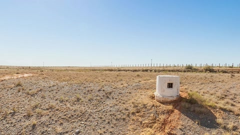 Arid utility site with sparse vegetation — Stillmotion