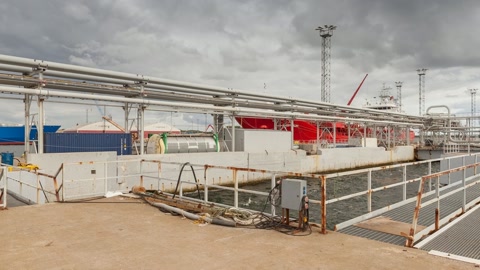Industrial pier by open water — Stillmotion