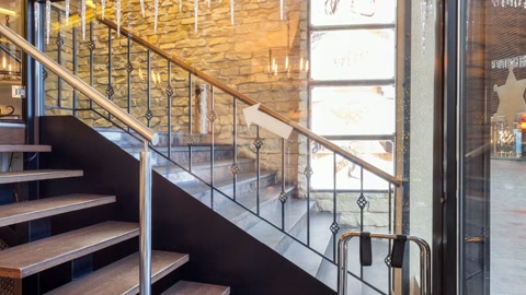 Mezzanine dining area with staircase — Stillmotion