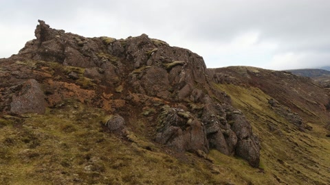 Rocky hillside under cloudy skies — Stillmotion