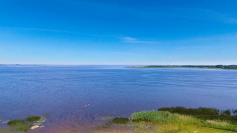 Rural lakefront fields and roads — Stillmotion