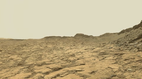 Rocky desert plain under hazy sky — Stillmotion