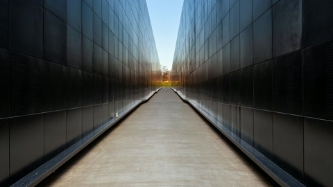 Narrow memorial wall corridor — Stillmotion
