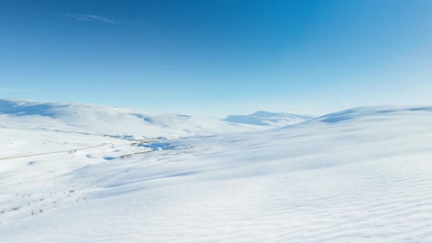 Snow-covered ice shelf under clear sky — Stillmotion