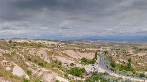 Cloudy badlands with rock spires — Stillmotion