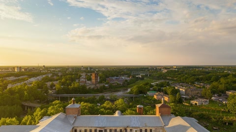 Aerial view over riverside buildings — Stillmotion