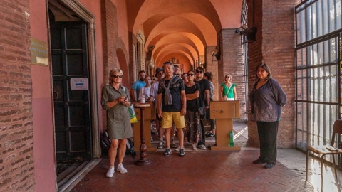 Historic brick arcade with iron gate — Stillmotion