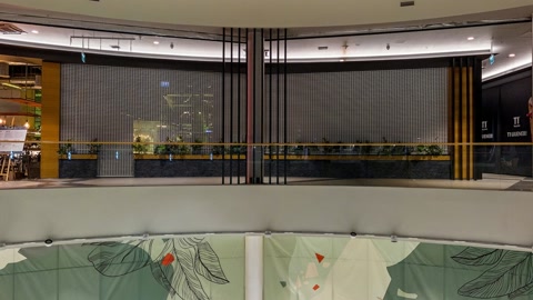 Mall mezzanine with escalators and storefronts — Stillmotion