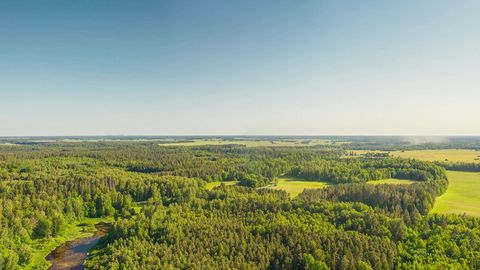 Aerial forest and farmland expanse — Stillmotion
