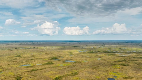 Cloudy tundra with scattered pools — Stillmotion