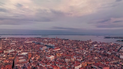 Harbor city under cloudy sunset skies — Stillmotion