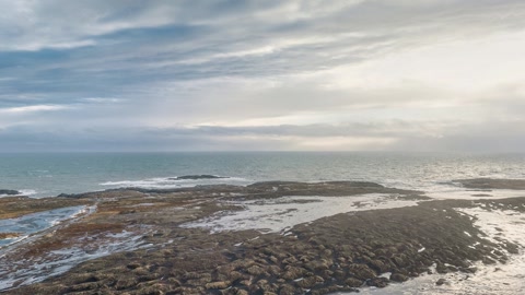 Icy rocky shoreline and sea — Stillmotion
