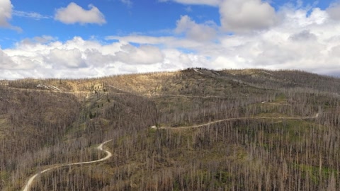 Cloudy mountain path with winding trails — Stillmotion