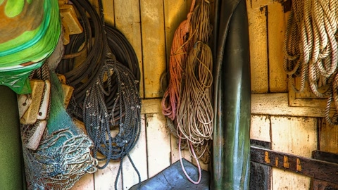 Cluttered rope storage shed interior — Stillmotion