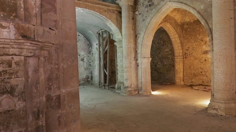 Illuminated stone arch ruins at night — Stillmotion