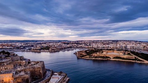 Harbor city under cloudy skies — Stillmotion