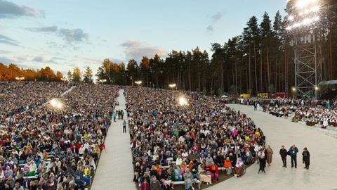 Large amphitheater audience gathering — Stillmotion