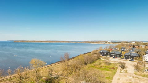 Coastal landscape with trees and buildings — Stillmotion