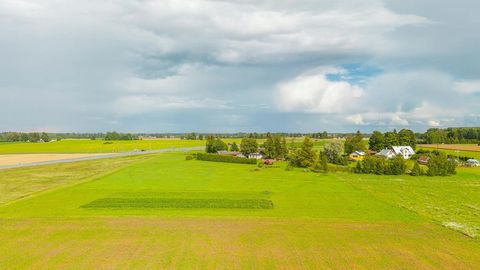 Cultivated field under cloudy skies — Stillmotion