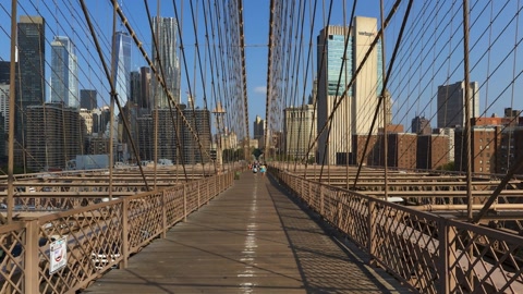 Suspension bridge over river and skyline — Stillmotion