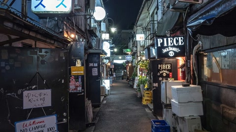 Narrow alley with bars and signs — Stillmotion