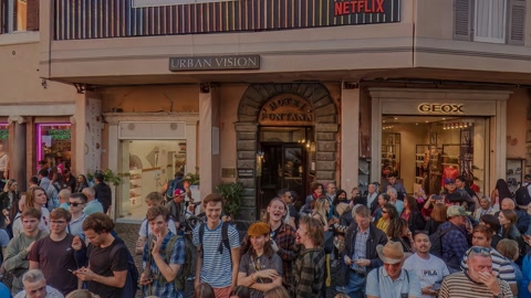 Crowded plaza with ornate fountain — Stillmotion