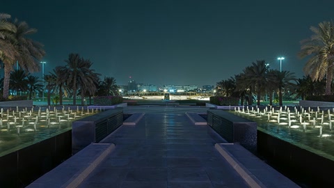 Night fountain plaza with illuminated mosque — Stillmotion