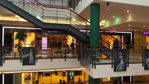 Indoor shopping mall with escalators — Stillmotion