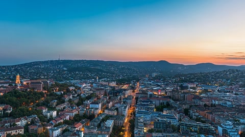 Aerial view over riverside city — Stillmotion