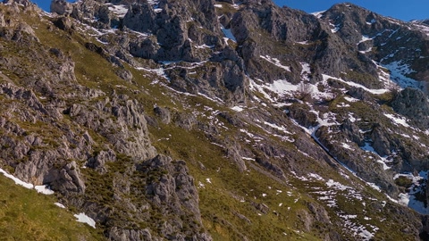Rocky mountain ridge with natural arch — Stillmotion