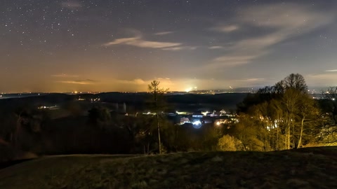 Night sky over hillside chapel — Stillmotion