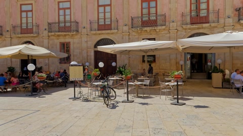 Historic plaza with café seating — Stillmotion