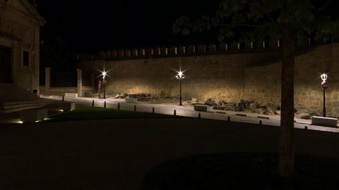 Lit historic courtyard at night — Stillmotion