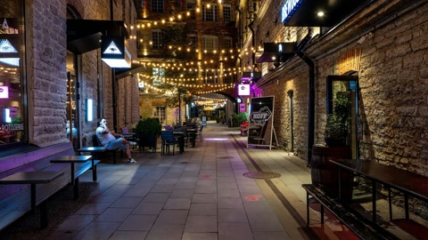 Narrow stone alley at night — Stillmotion