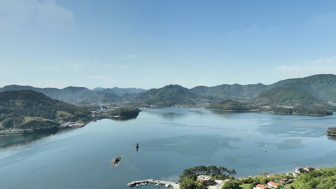 Forest-covered islands over calm lagoon — Stillmotion